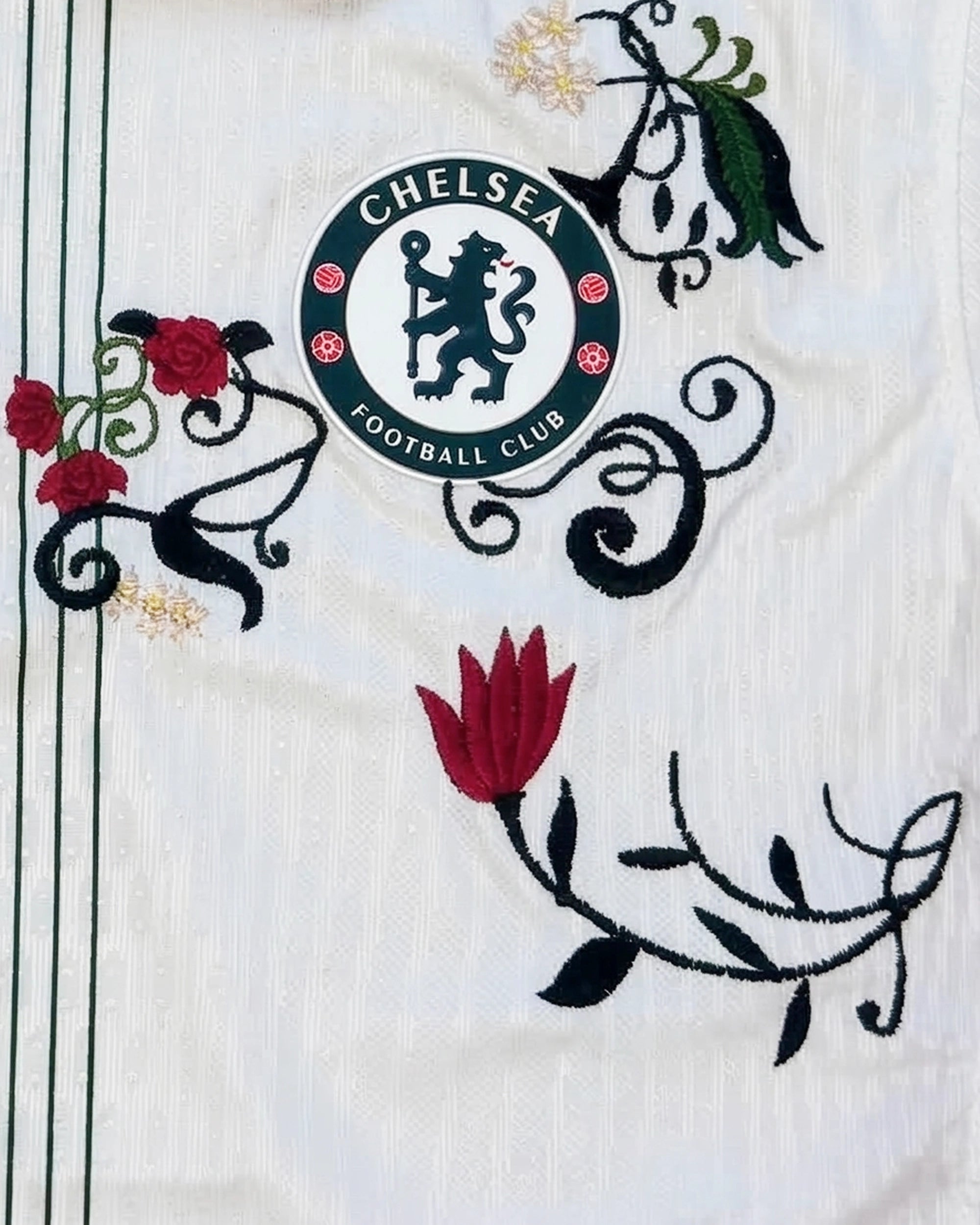 Detailed embroidery on the Chelsea Bloom Edition featuring the swoosh framed by Chelsea Embroidered Jersey art.