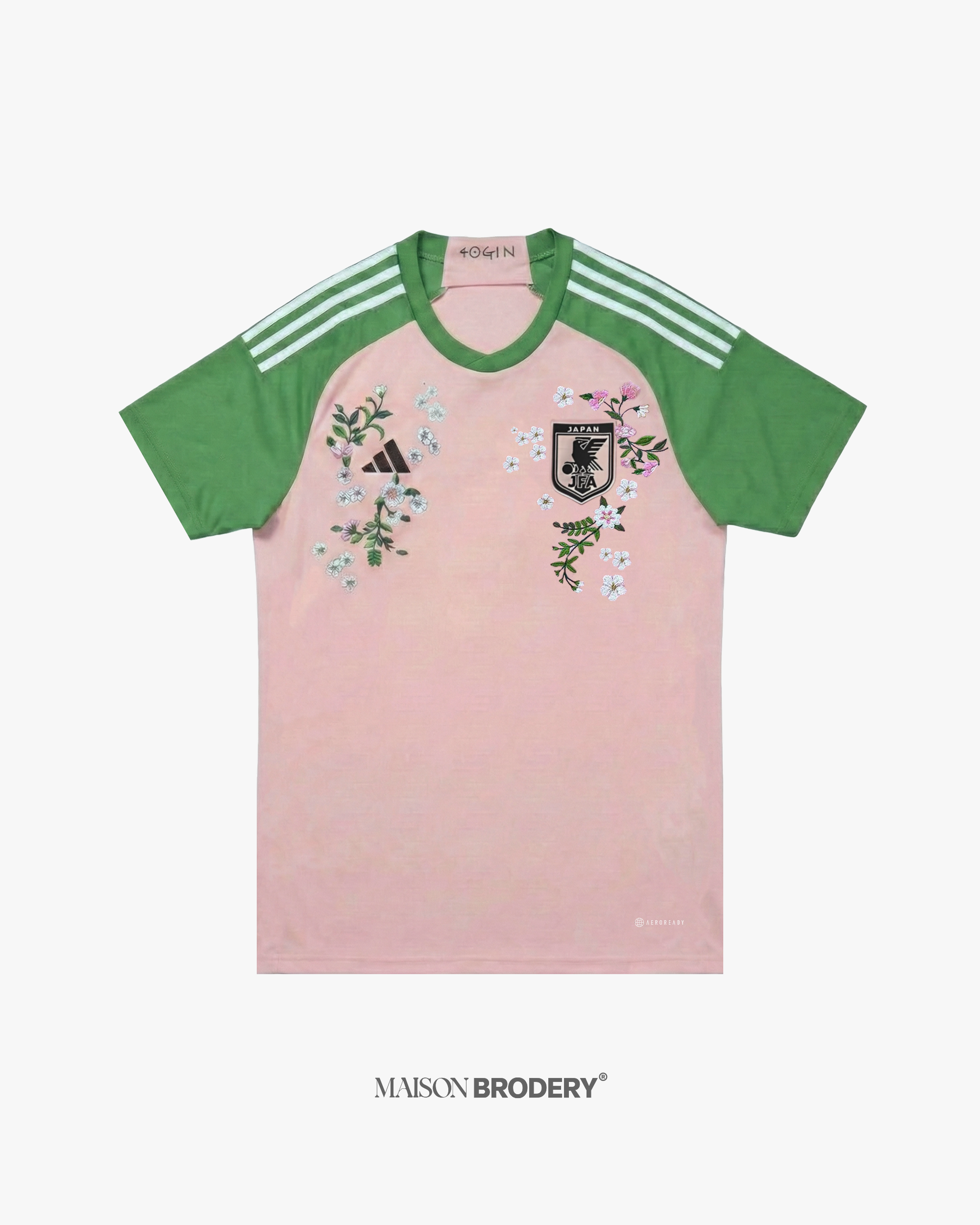 Embroidered Japan x Nigo 2022 shirt featuring pastel tones and vibrant floral stitching on a pink and green base.