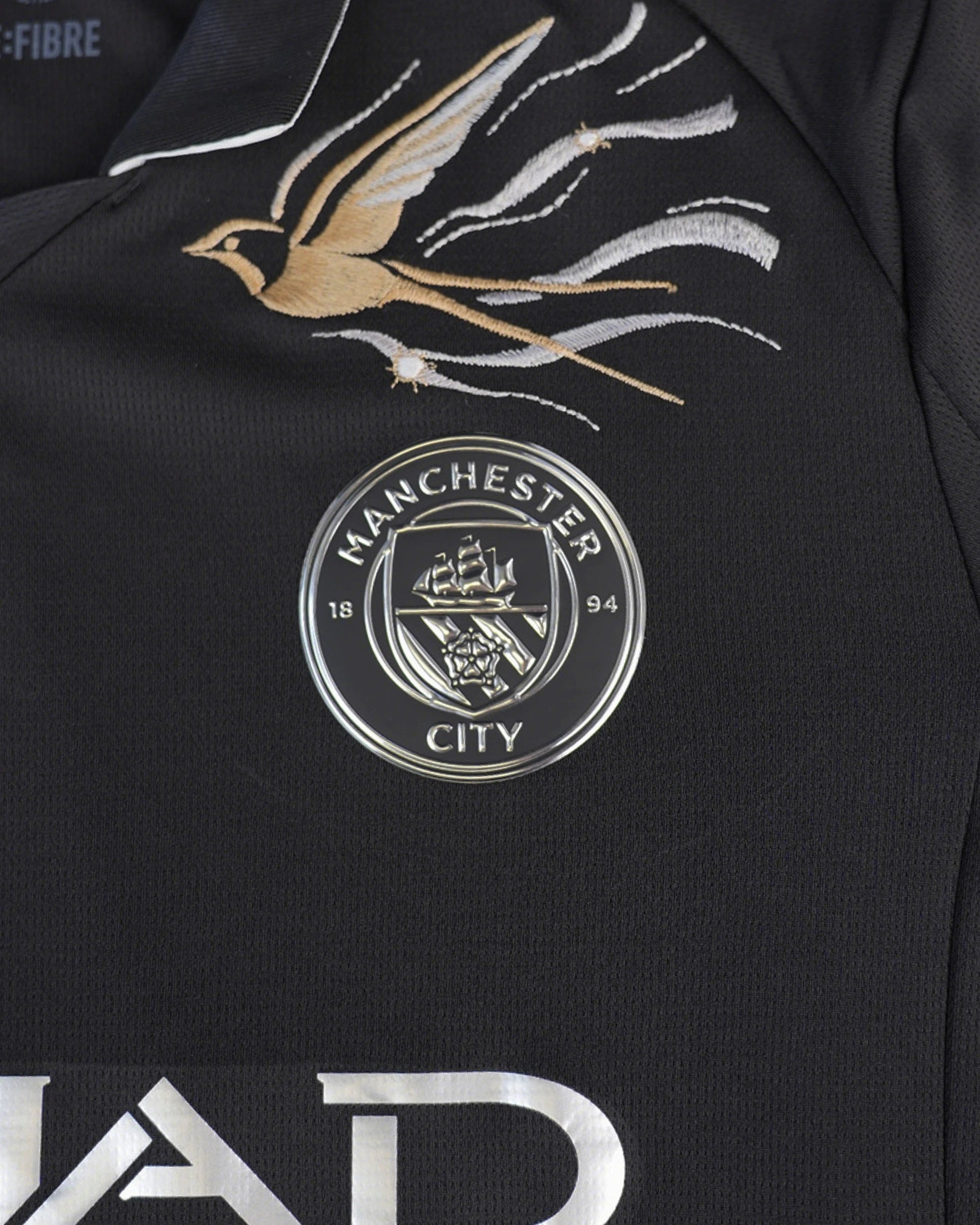 Detailed embroidery on the Manchester City “Nightcall” 2025-26 edition jersey highlighting the front logo.