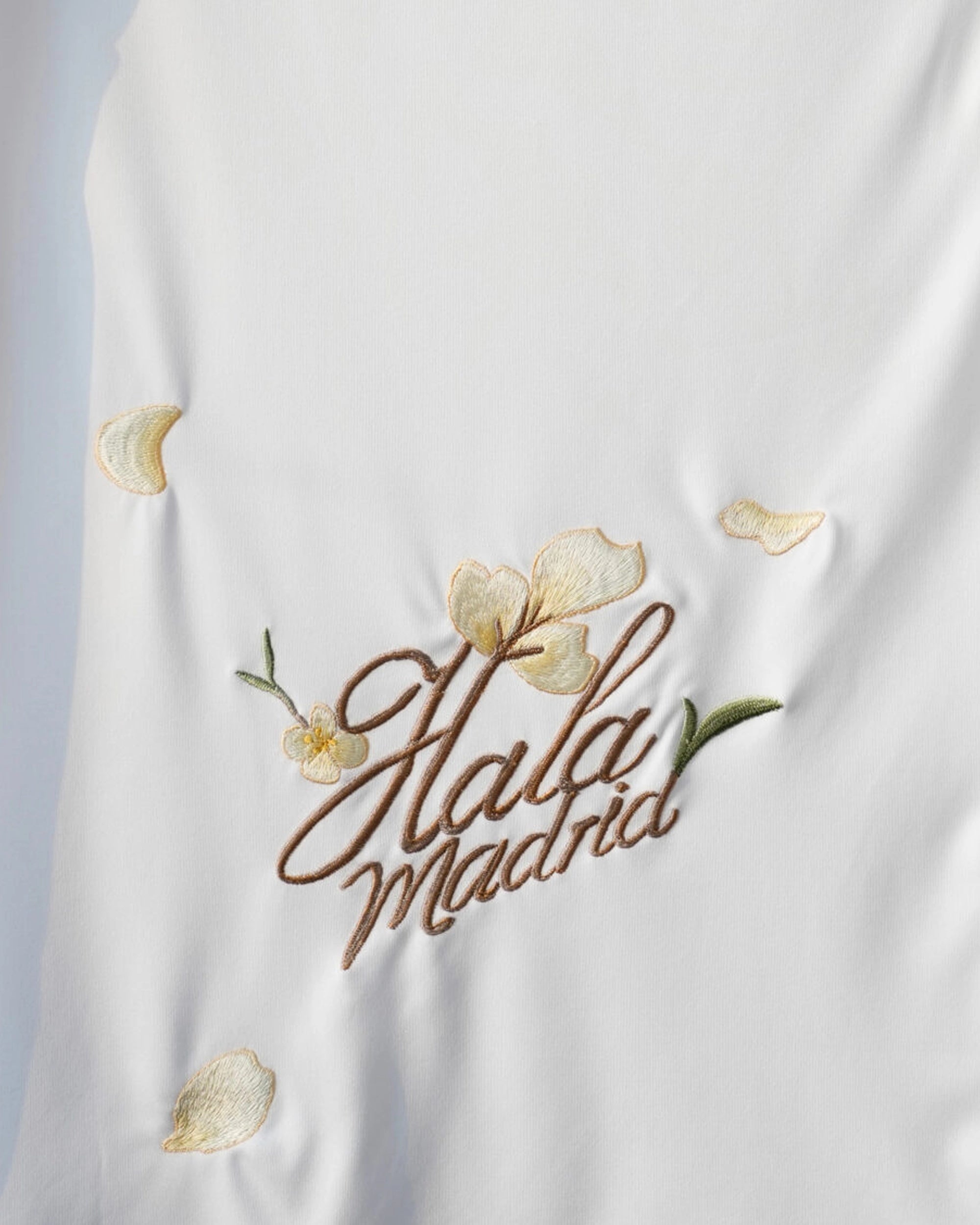 Close-up back detail of the Real Madrid 'Golden Flowers' Edition 2025-26 Jersey, highlighting the elegant golden botanical stitching on this Real Madrid Embroidered Jersey.