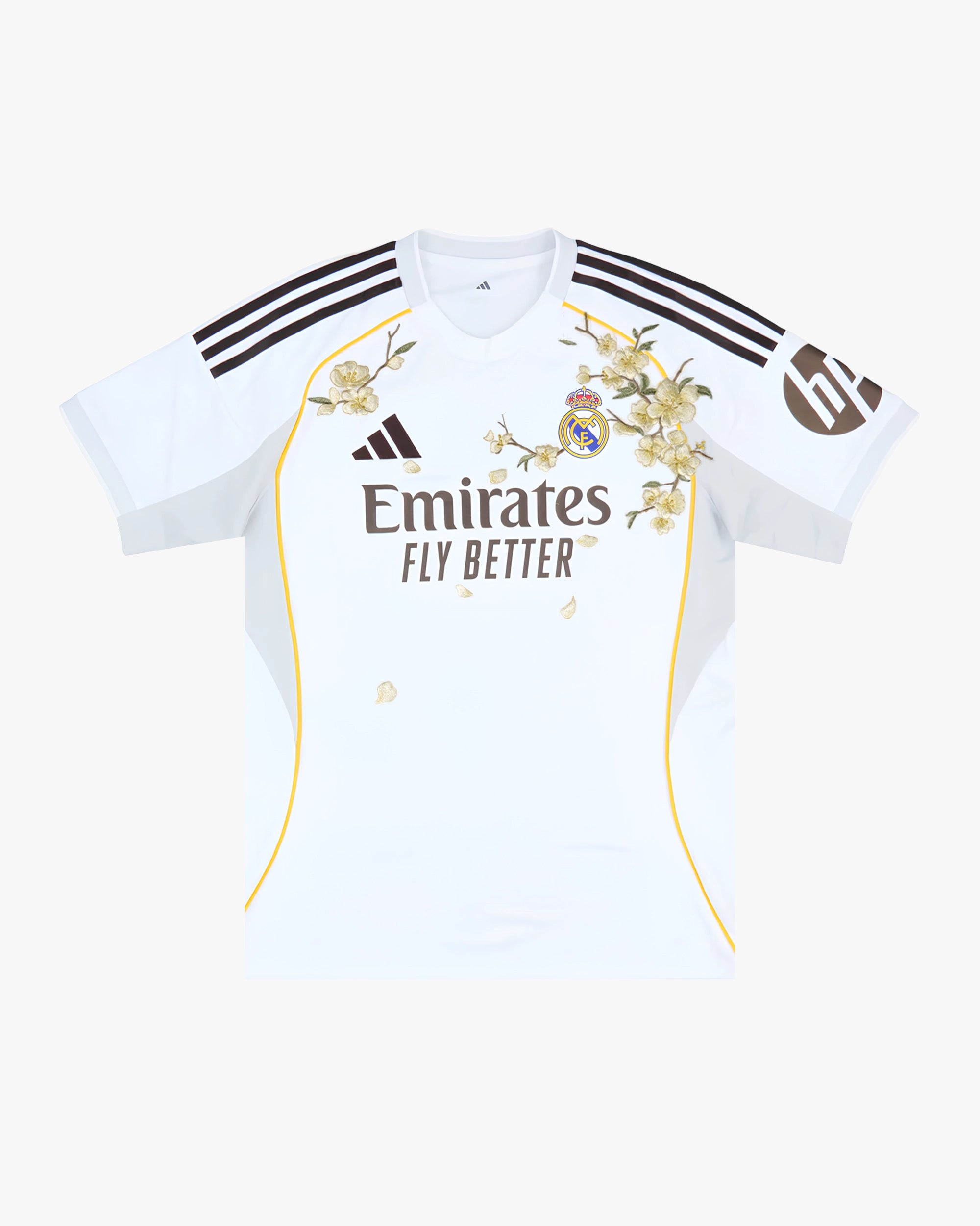 Full front view of the Real Madrid 'Golden Flowers' Edition 2025-26 Jersey featuring a pristine white base and intricate golden botanical stitching.