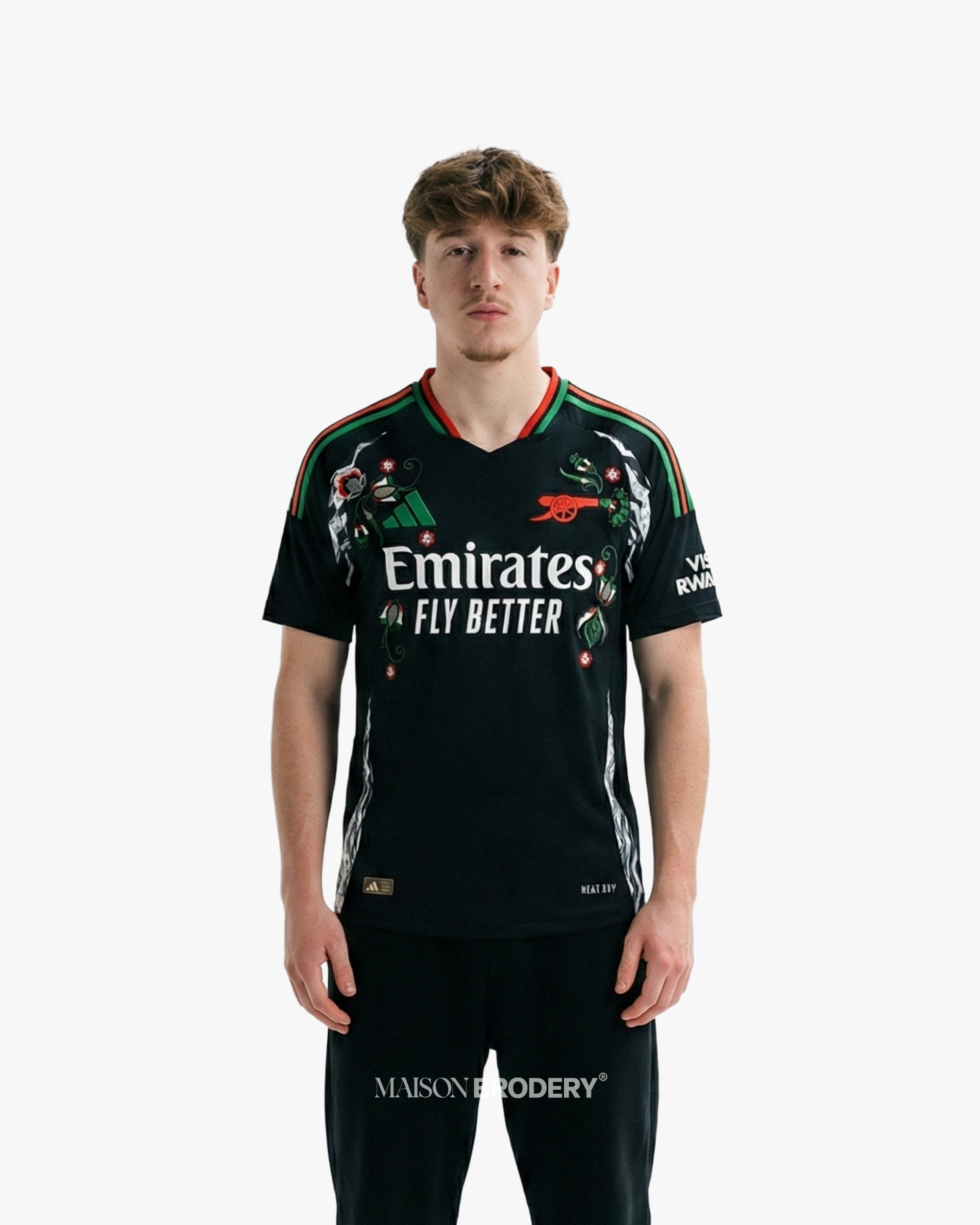 Embroidered Arsenal Away Jersey 2024-25 worn by a model, featuring black base and floral embroidery design.