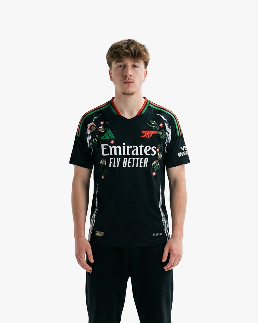 Discover the Embroidered Arsenal Away Jersey 2024-25. A bold black design accented with red and green stripes and unique cultural floral embroidery.