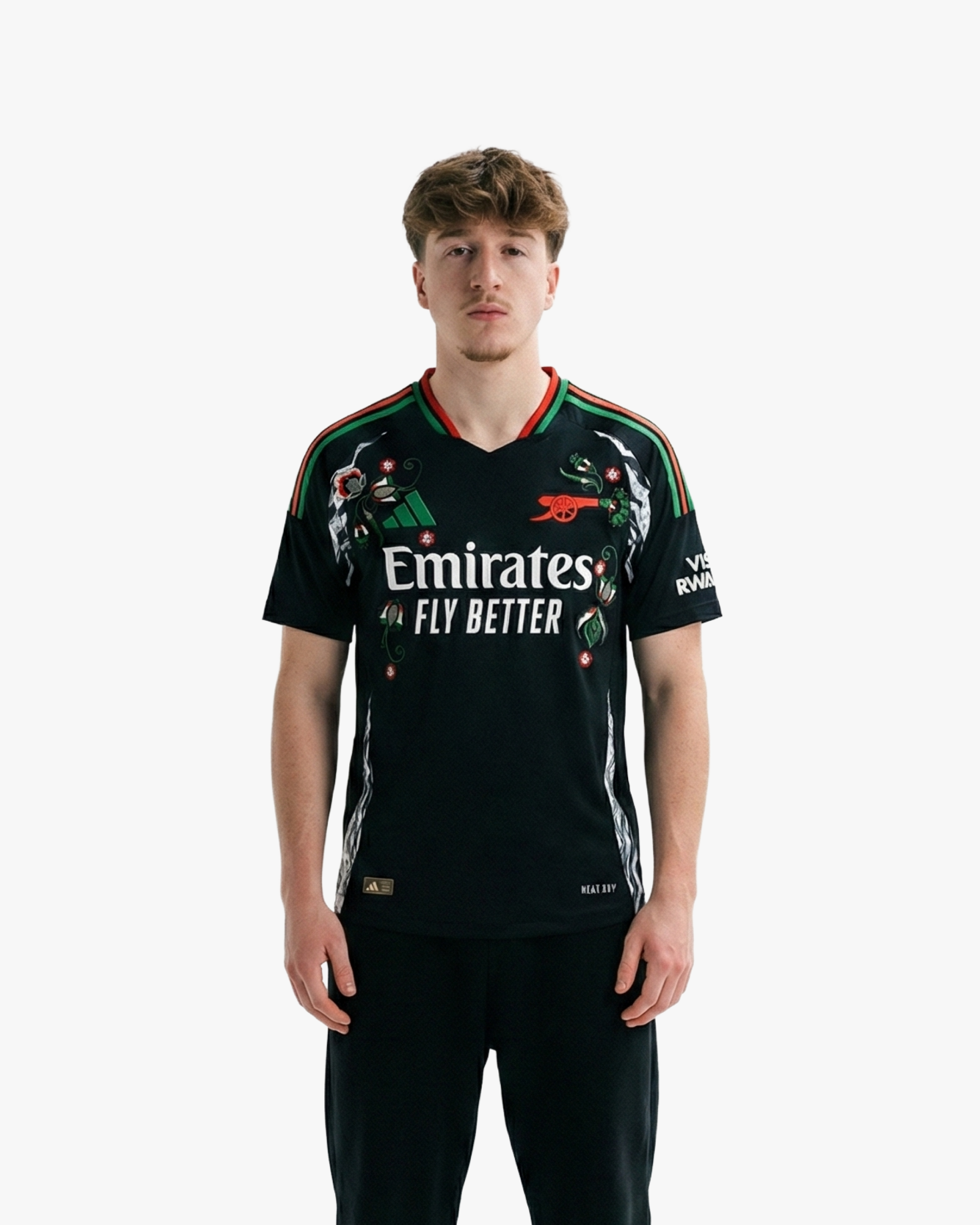 Discover the Embroidered Arsenal Away Jersey 2024-25. A bold black design accented with red and green stripes and unique cultural floral embroidery.