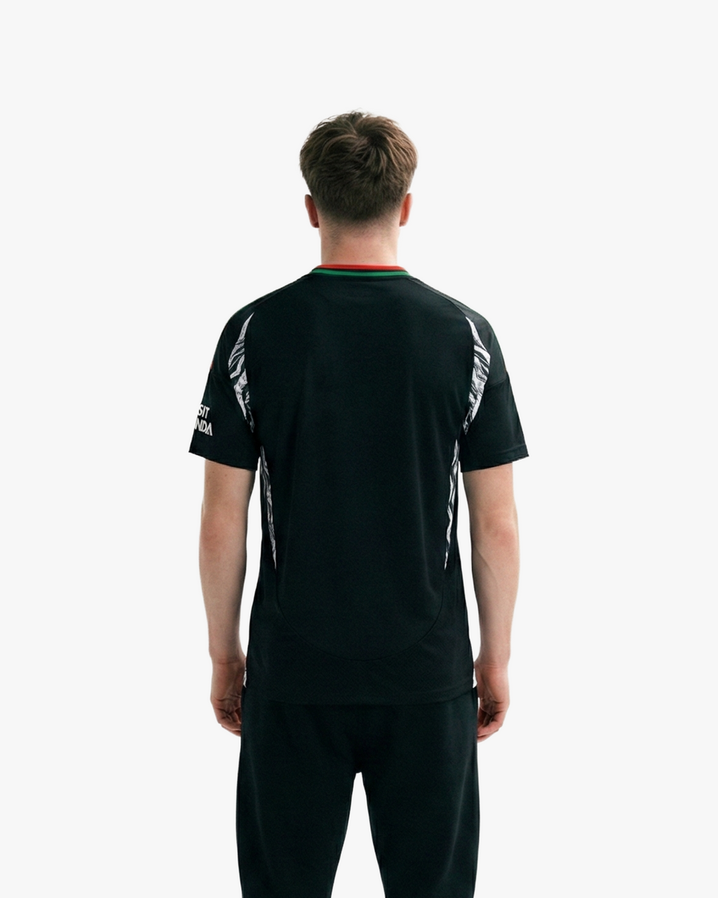 The Embroidered Arsenal Away Jersey 2024-25 combines heritage and style with its striking floral motifs, red cannon crest, and modern athletic fit.