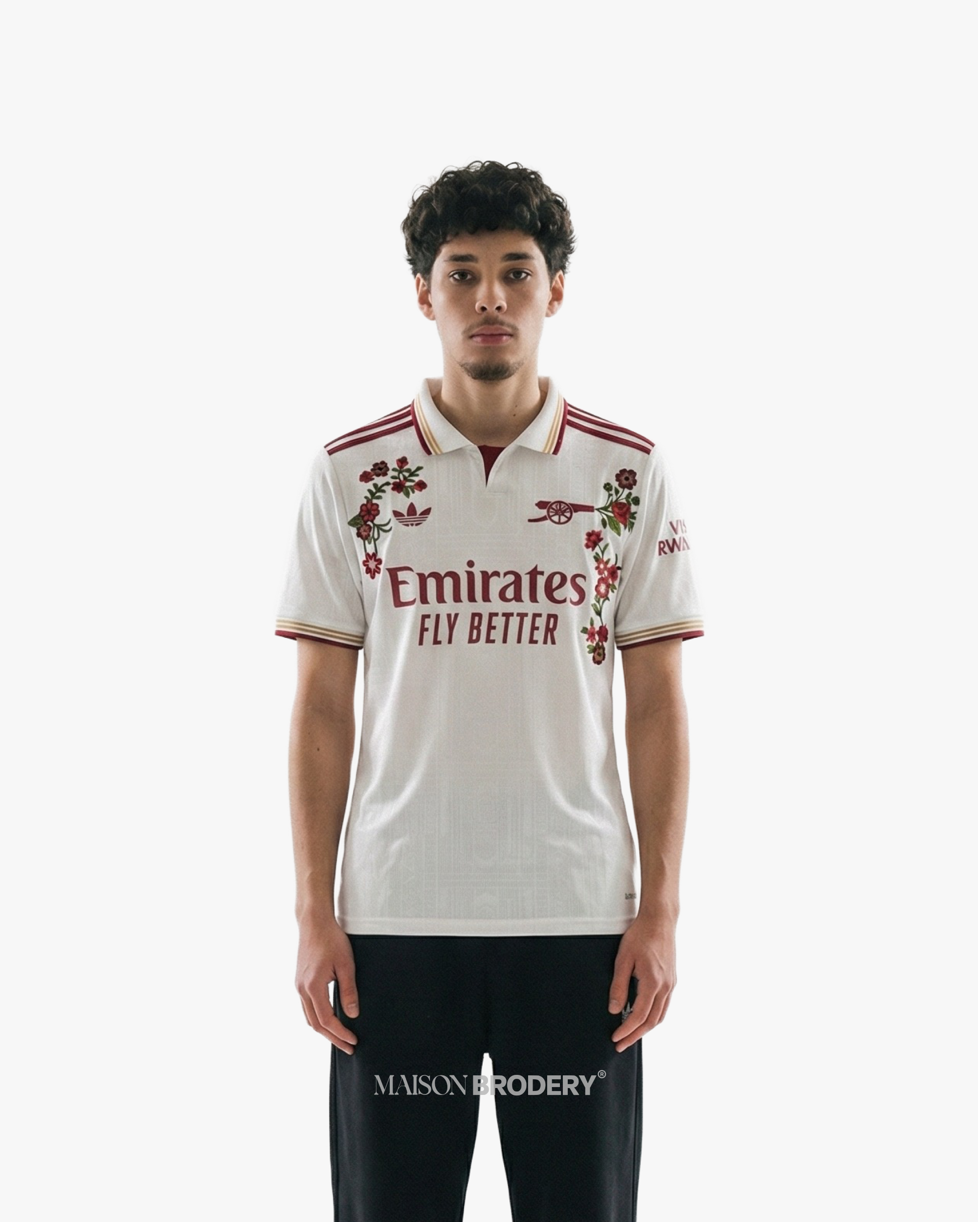Embroidered Arsenal Third Jersey 2025-26 displayed on a model, featuring floral designs and burgundy accents.