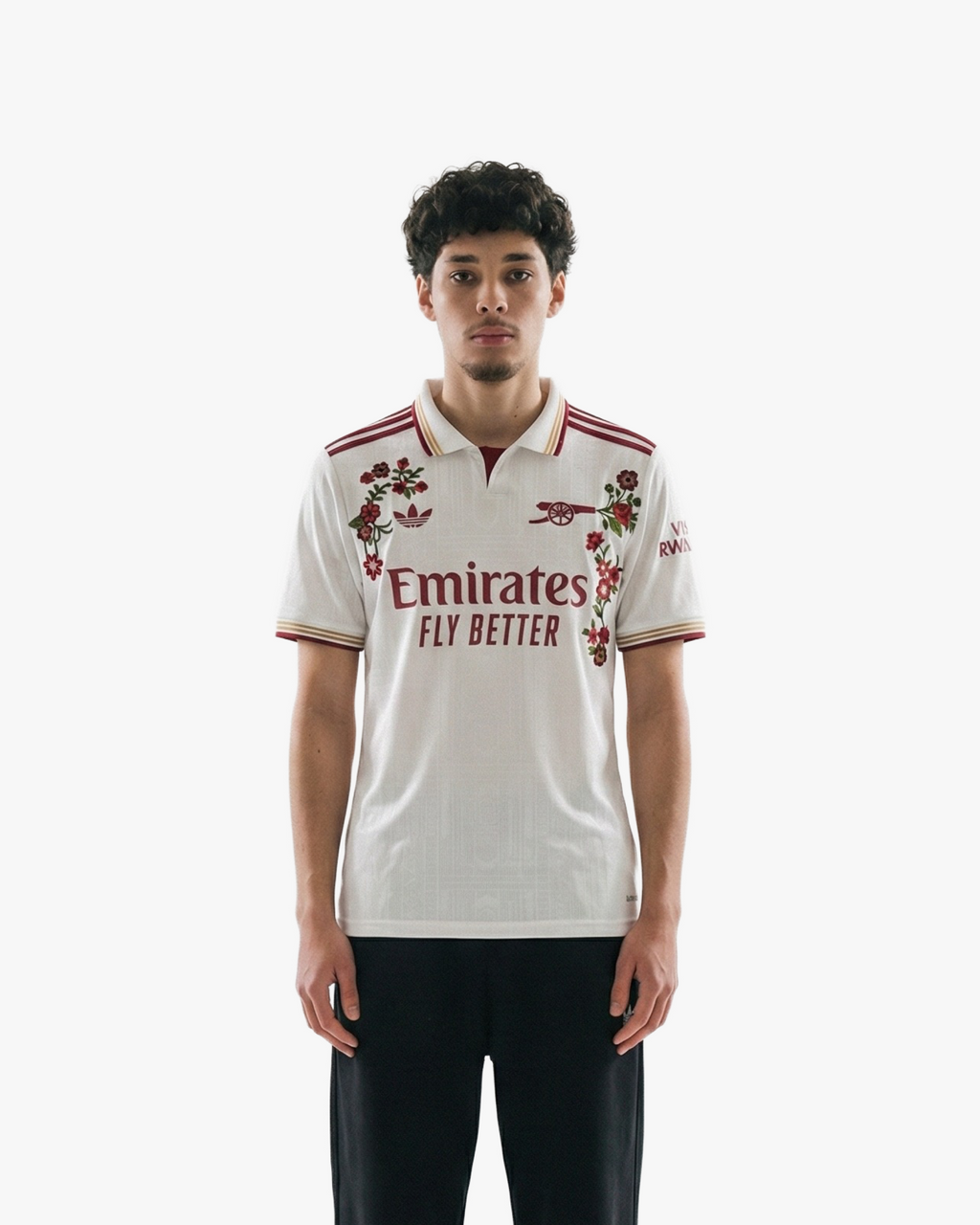 The Embroidered Arsenal Third Jersey 2025-26 on model, showcasing its modern athletic fit and striking red-on-white aesthetic.