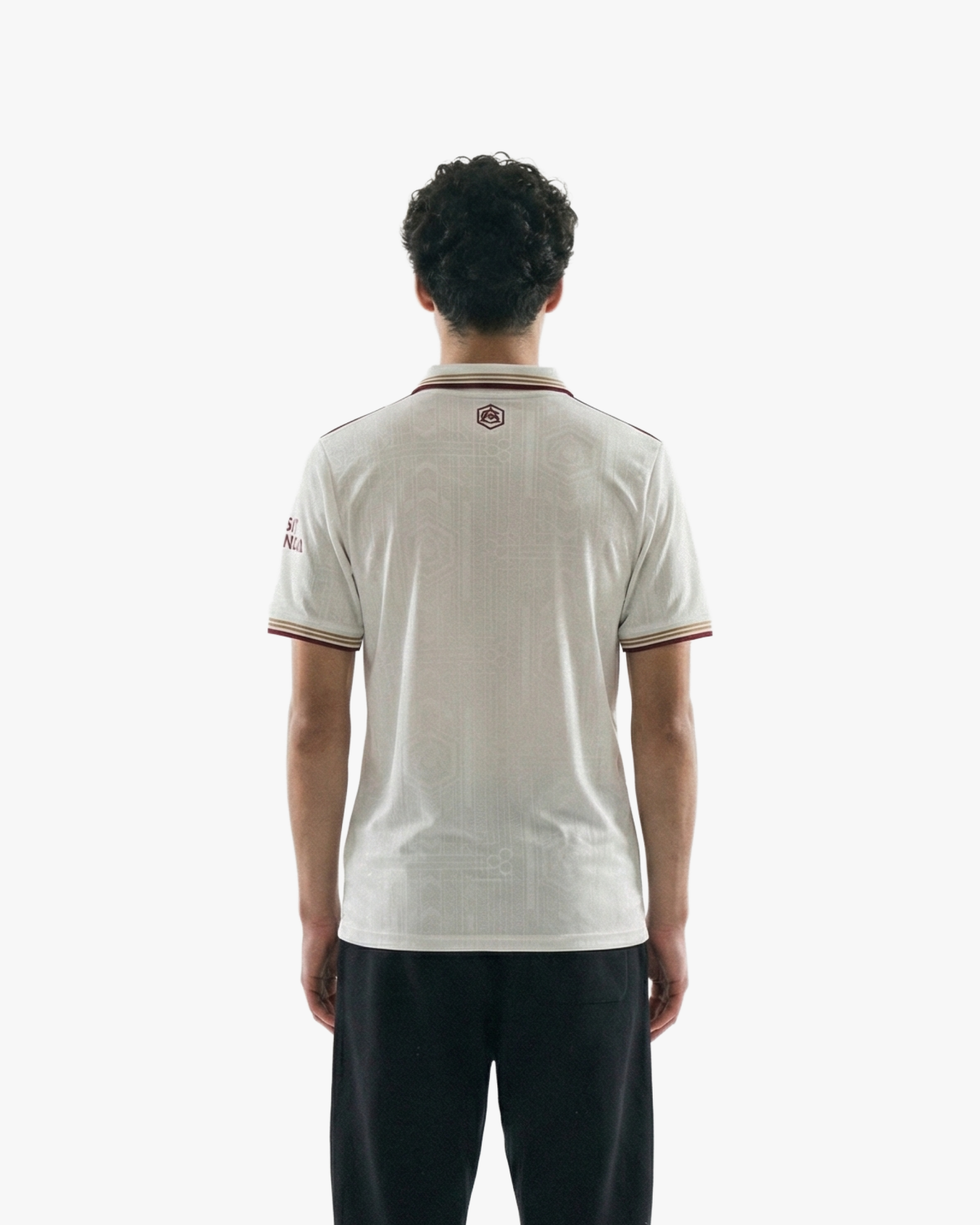 Back view of the Embroidered Arsenal Third Jersey 2025-26 on model, highlighting the athletic fit and clean red-on-white detailing.