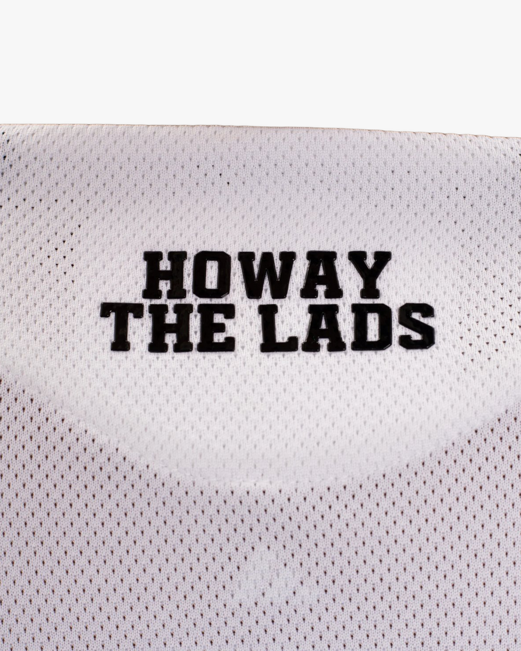 A close-up view of the Embroidered Newcastle Home Jersey 2025-26 detailing the iconic black and white stripes and premium textured fabric.