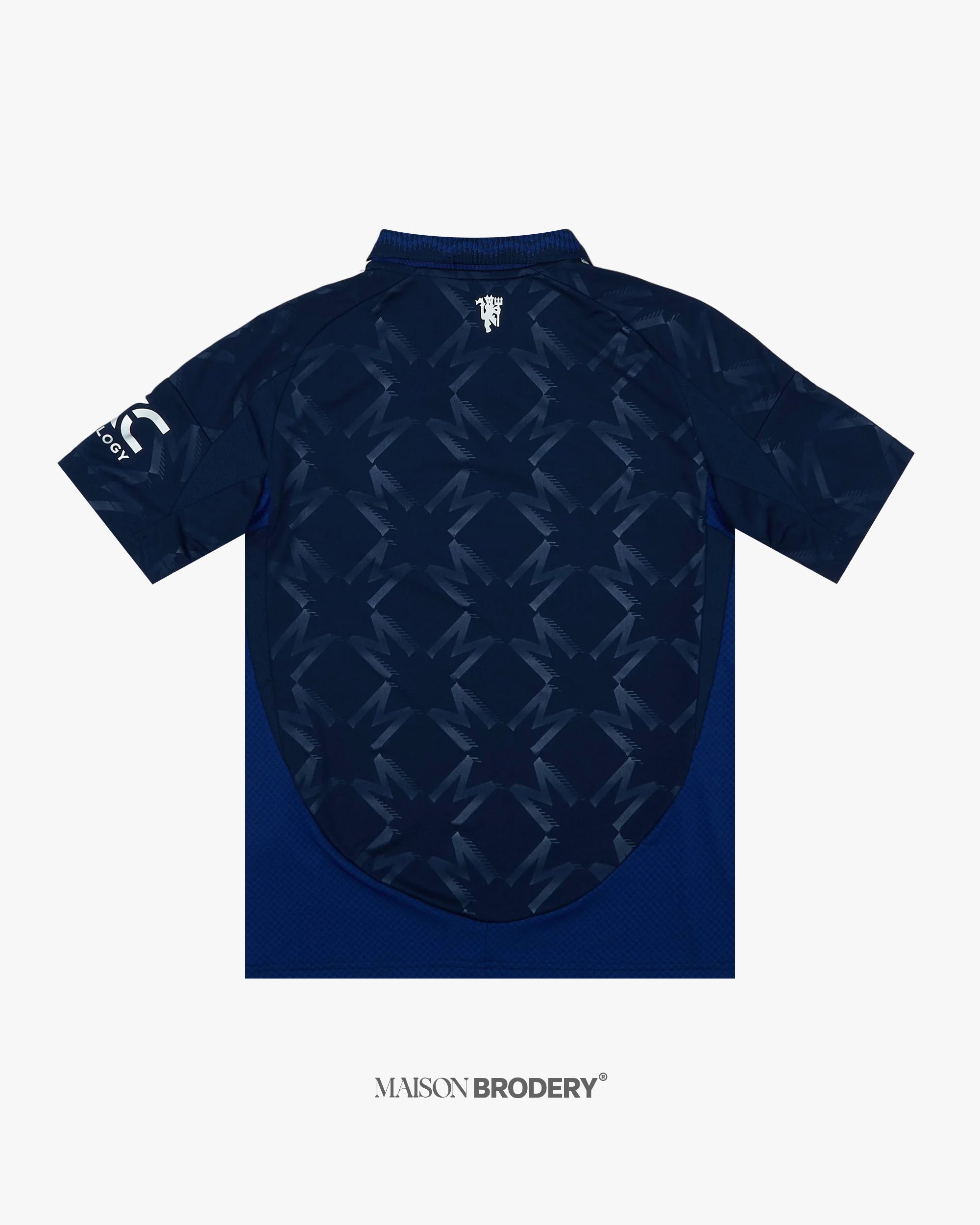 Back view of the Embroidered Manchester United Away Jersey 2024-25 featuring navy base and geometric patterns.