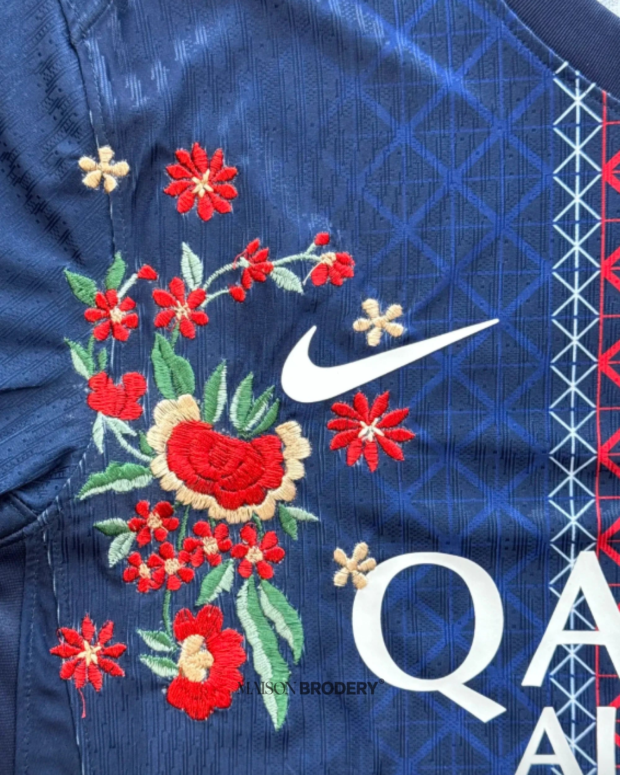 Close-up of the floral embroidery on the Embroidered PSG Home Jersey 2025-26, showcasing intricate details and craftsmanship.
