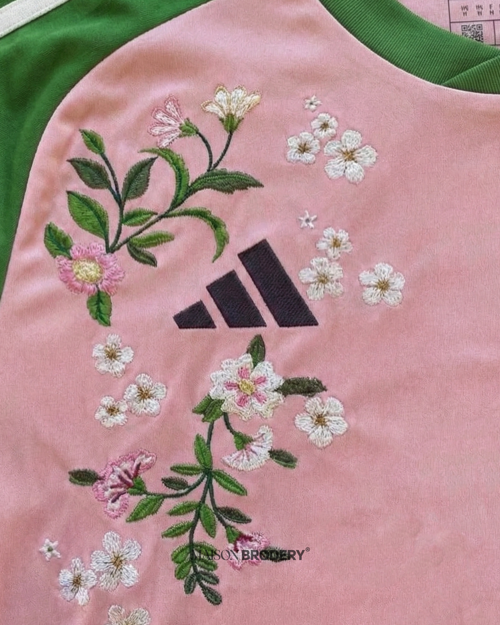 Embroidered Japan x Nigo 2022 features pastel colors and vibrant floral stitching on a pink and green design.