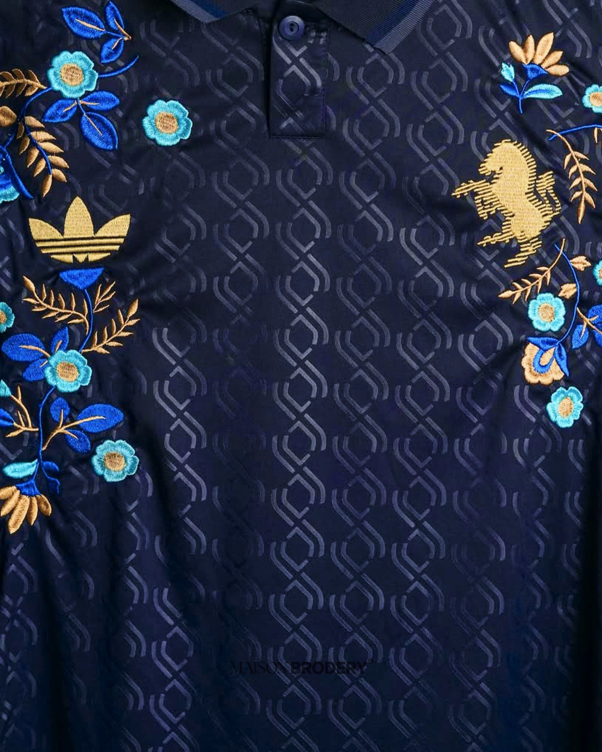 Embroidered Arsenal Away Jersey 2024-25 featuring intricate floral designs on a deep navy background.