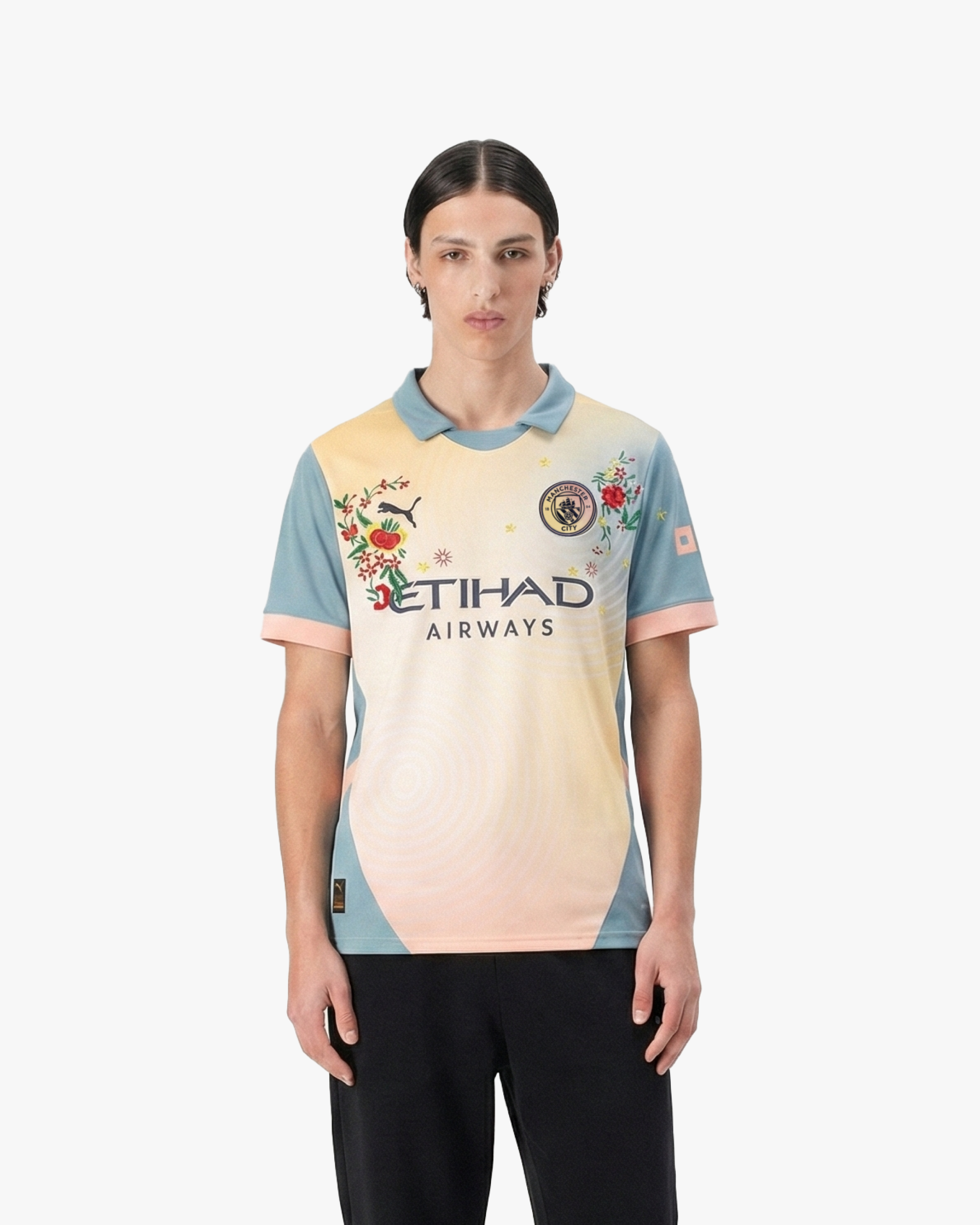 Athletic fit of the Embroidered Manchester City Fourth Jersey 2024-25 on model, highlighting the unique 90s-inspired aesthetic and embroidered details.