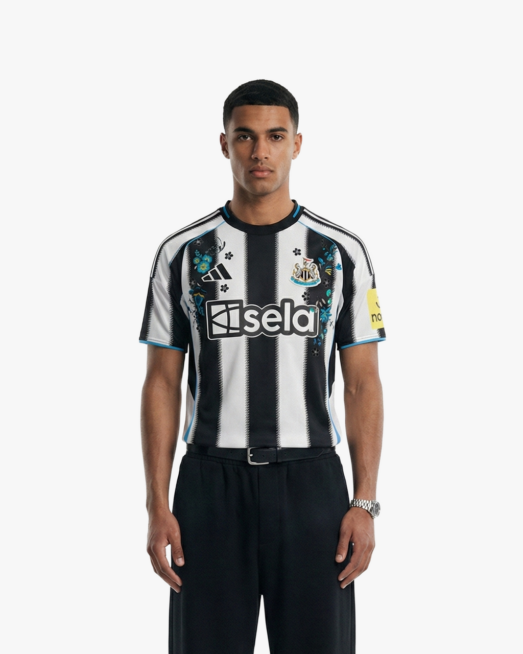 The Embroidered Newcastle Home Jersey 2025-26 on model, highlighting its modern athletic fit and unique embroidered aesthetic.