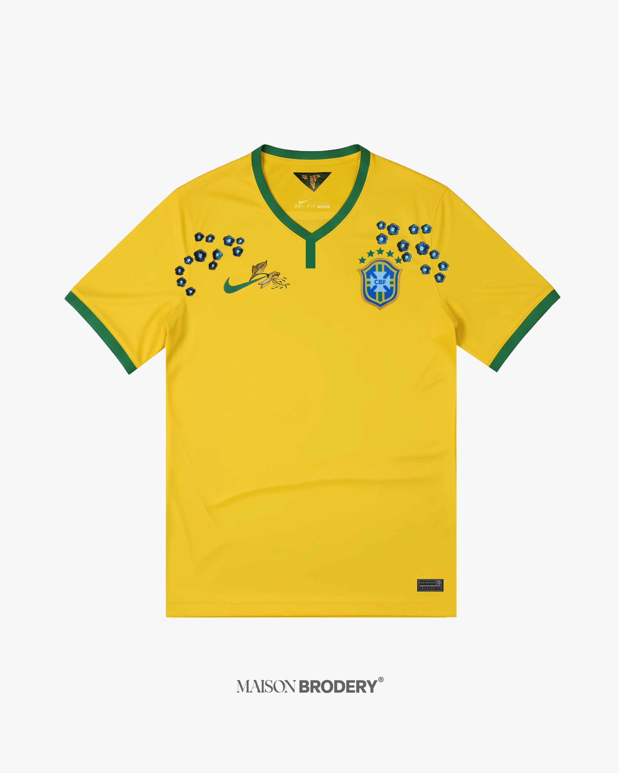 Embroidered Brazil Home Jersey 2014 featuring vibrant yellow base and intricate green trims.
